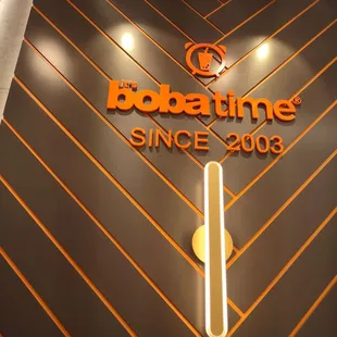 the logo on the wall