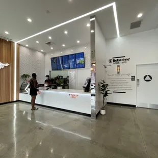 a woman standing in front of a counter