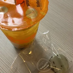 Lychee fruit tea with boba and macarons