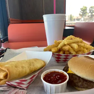 a hamburger, french fries, and ketchup