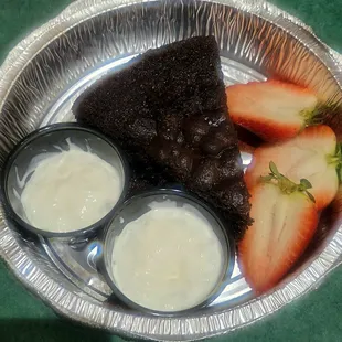 Sokolatopita which is chocolate cake with a rum sauce with berries and cream.