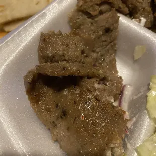 Very small portions of low grade gyro meat.  When I was got it and I smelled the container before I opened it, I could smell hotdogs