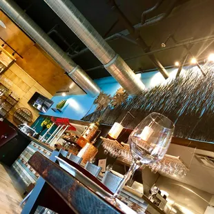 a glass of wine on the bar