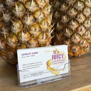 two pineapples on a table