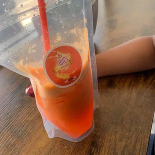 a plastic cup with a straw