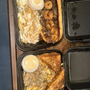 Surf and turf poboy with Cajun ranch fries and crawfish grilled cheese with crab meat fries
