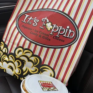 a bag of popcorn and a cup of coffee