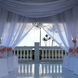 Showcasing our custom white flooring &amp; chiffon ceiling drapes
