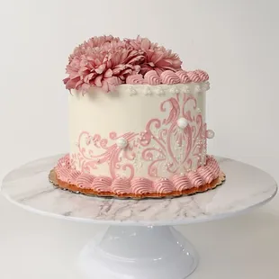 a cake with pink flowers