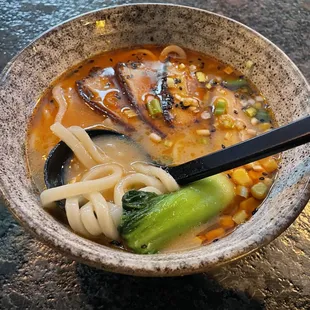 a bowl of ramen with noodles and vegetables
