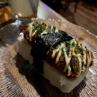 Pig head katsu musubi. Not my mama&apos;s Spam musubi. So decadent!