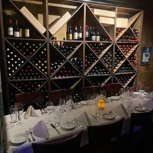 Private dining with a wine rack .
