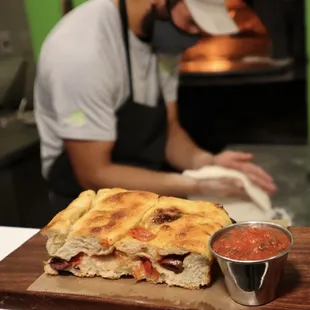 a chef preparing a sandwich