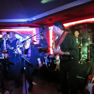 a band playing in a dimly lit room