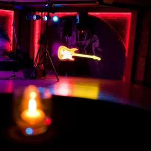 a candle lit up in the middle of the room