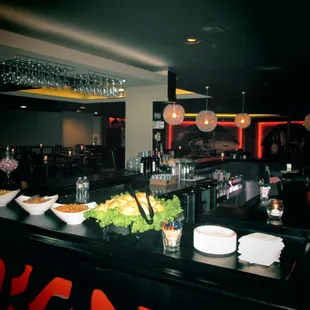 a view of a bar with food on the counter