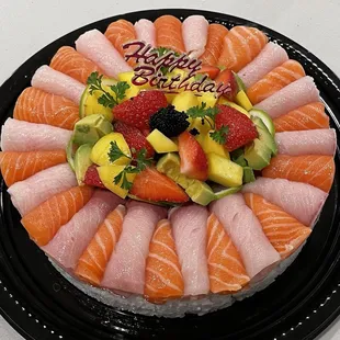a plate of sushi and fruit
