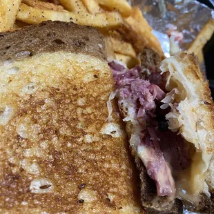 Rueben Sandwich with seasoned fries