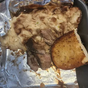 a piece of meat and potatoes