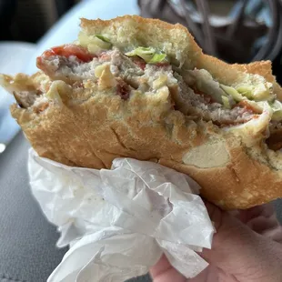 Grilled Tenderloin with custom toppings, bacon, lettuce, tomato, mozzarella cheese, and mayonnaise
