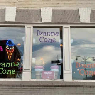 the reflection of an ice cream cone in the window