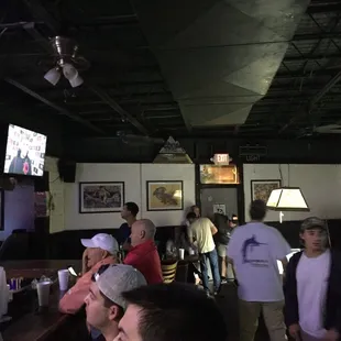 a group of people in a bar