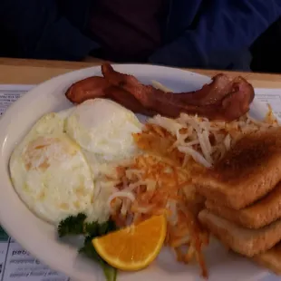 Two eggs, meat, hash browns and toast or two small pancakes. Crispy hash browns--bonus!  All for $7.50, awesome!!