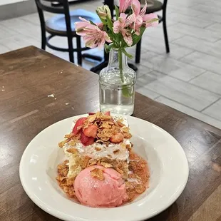 Cornbread Tres Leches with Sweet cream, macerated fresh strawberries, finished with Strawberry Gity Gelato