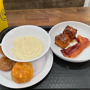 Sausage patties, homemade biscuit, the best grits I have ever eaten in my life, bacon, and French toast made with the homemade biscuits.