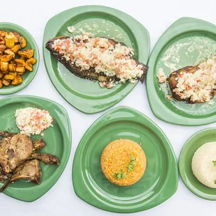 Grilled fish, chicken &amp; lamb chops with jollof rice, plantain &amp; white rice.