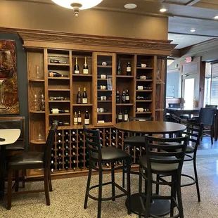 a dining area with tables and chairs