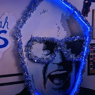 the face of a man with glasses