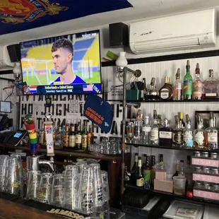 a bar with a large screen tv
