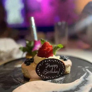 a dessert with a happy birthday sign