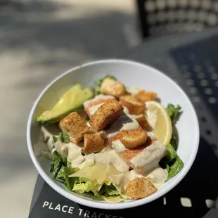 Caesar salad with salmon.