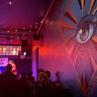 a man on stage in front of a crowd