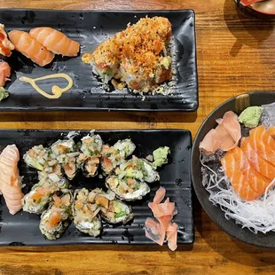 Bottom - scallop, Godzilla roll, burn salmon  Top- two salmon pieces, scallop, Hawaiian roll  Right - salmon sashimi