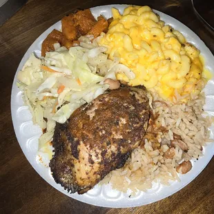 jerk chicken, cabbage, MSc and cheese, rice &amp; peas, and yams