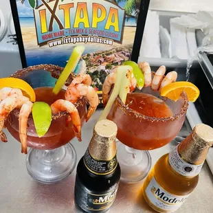 two cocktails and a bottle of beer