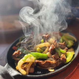 a skillet of food being cooked