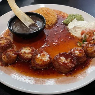 Chicken wrapped in bacon with an amazing sauce