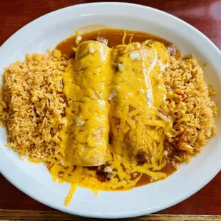 a plate of enchiladas and rice