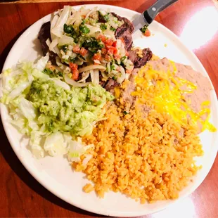 a plate of mexican food on a table