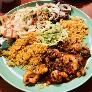 a plate of mexican food on a table