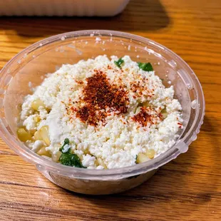 Esquites - corn with herbs, cheese, lime juice, and mayo.  Personally it&apos;s meh...