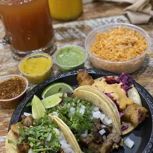Tripa taco, lengua taco &amp; pescado taco (L-R) w/ salsa, arroz &amp; a michelada. My friends got mango margaritas which were great too