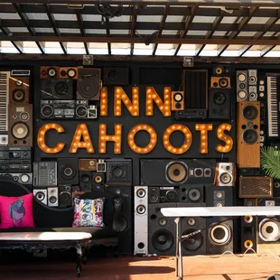 a stage with speakers and a couch