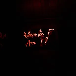 a neon sign in the dark