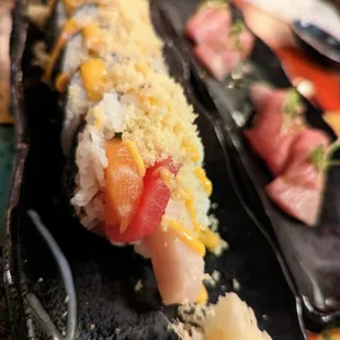 Iza Crunch Raw Specialty Roll. $14. Cucumber, tuna, salmon, yellowtail, shiso, spicy mayo, tempura crunch.