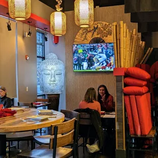 Inside. Street-facing dining room with TV.